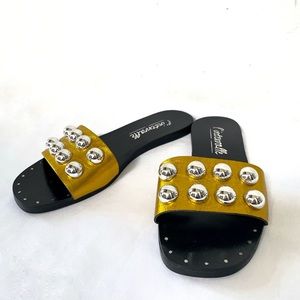 L’Intervalle gold sandal slides leather metallic studded flat black sole